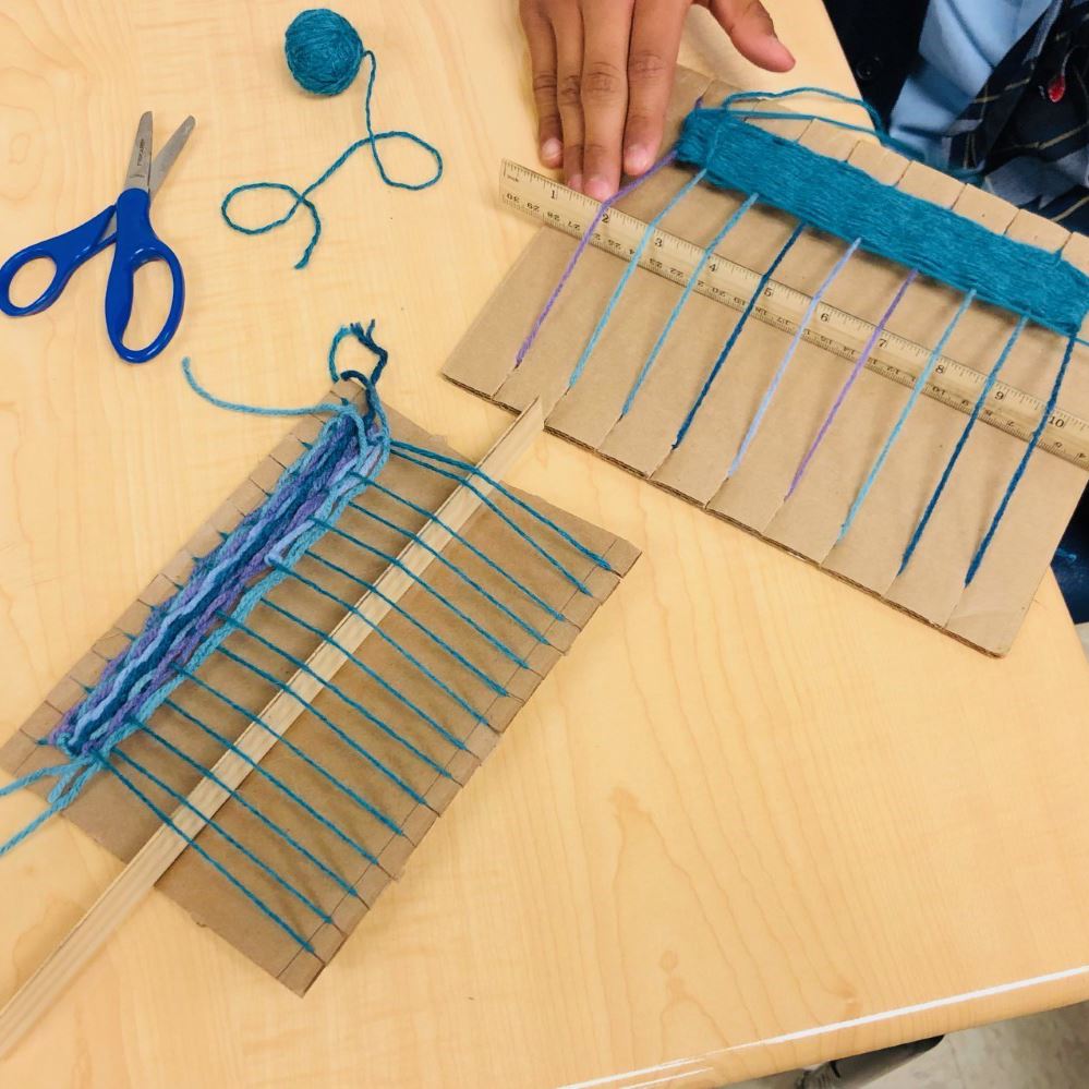  Overhead view of a loom created by students for passport project